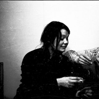 Two people playing a card game.