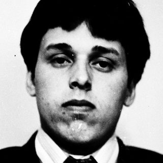 Young man in formal attire posing for portrait.