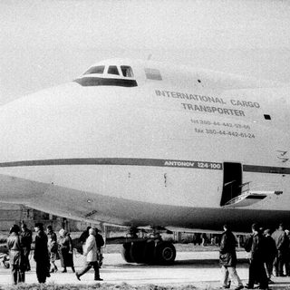 Massive Antonov An-124 cargo plane with crowd.