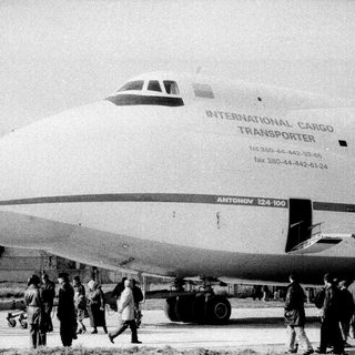 Massive Antonov An-124 cargo plane with crowd.