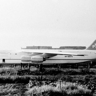 Massive Antonov An-225 cargo aircraft on ground.