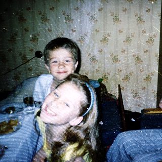 Family indoors during rainy or snowy weather.