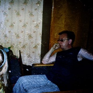 Family indoors during rainy or snowy weather.