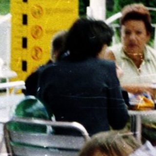 Children in school uniforms eating outdoors at McDonald's.