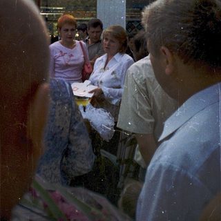Group of people gathered outdoors, possibly at a hospital.