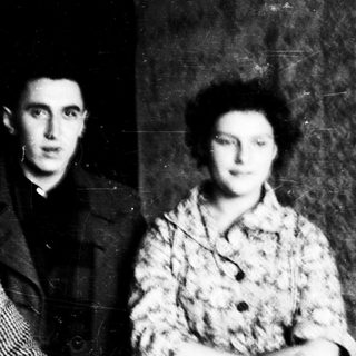 Three individuals in early-to-mid 20th-century clothing.