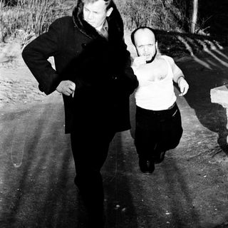Two people running outdoors in winter.