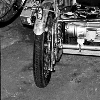 Vintage motorcycle with sidecar in garage.