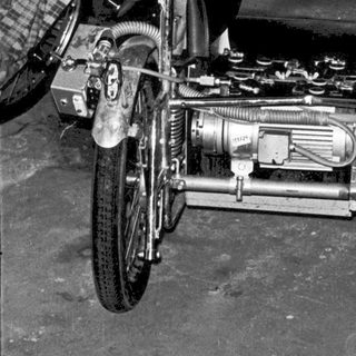 Vintage motorcycle sidecar with exposed engine.