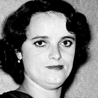 Portrait of a woman in 1940s-style clothing.