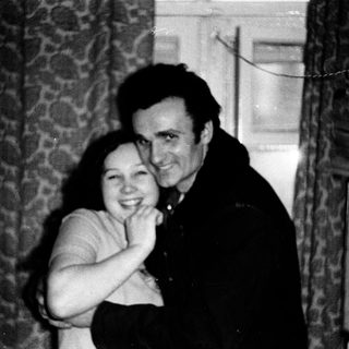 Happy couple posing indoors together.