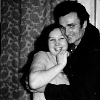 Happy couple posing indoors together.