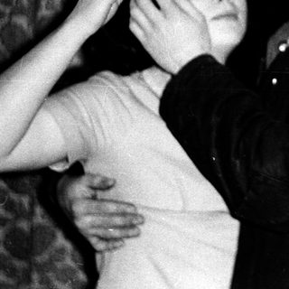 Intimate moment between two people indoors.
