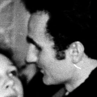 Intimate moment between two people indoors.