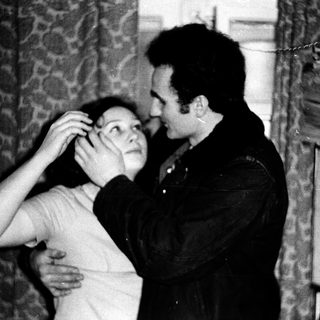 Intimate moment between two people indoors.
