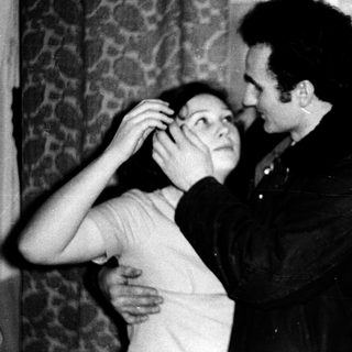 Intimate moment between two people indoors.