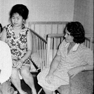Family group portrait from mid-20th century.