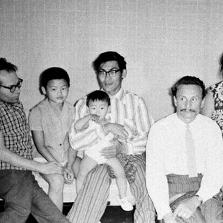 Family group portrait from mid-20th century.