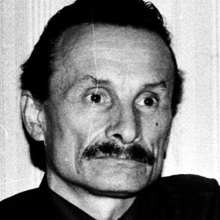 Two men posing together in a candid black-and-white photo.