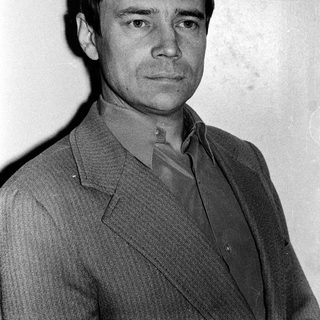 Portrait of a man in a suit, mid-20th century style.
