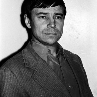 Portrait of a man in a suit.