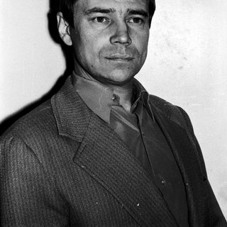 Portrait of a man in a suit.