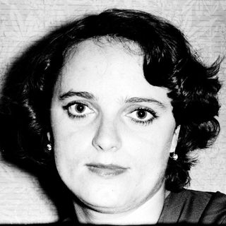 Black-and-white portrait of a woman with short hair.