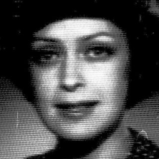 Vintage portrait of a woman in 1940s-style attire.