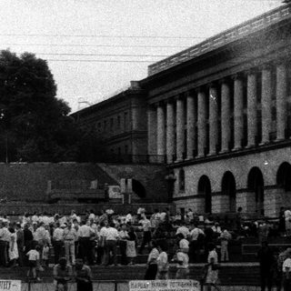 Mass gathering with banners during public demonstration.