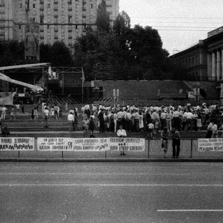 Mass gathering with banners during public demonstration.
