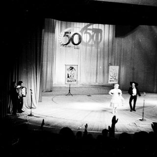 Fiftieth anniversary celebration on stage with performers.