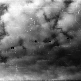 Cloudy sky with bullet holes.