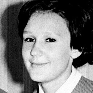Two women posing together in formal attire, black-and-white.