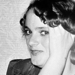 Portrait of a woman in 1920s-30s style clothing.