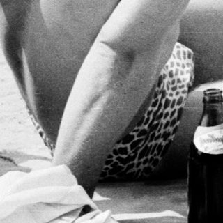 Sunbathing and socializing at a beach party.