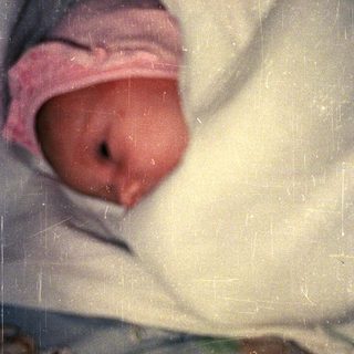 Newborn baby wrapped in a blanket.