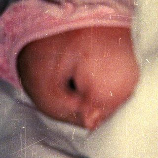 Newborn baby wrapped in a blanket.