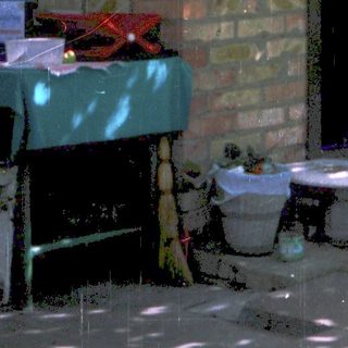 A person standing in doorway with open door.