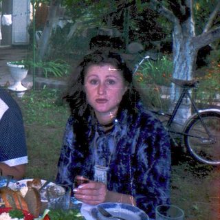 Group of women enjoying outdoor meal together.