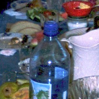 Group celebrating outdoors at a dinner table.