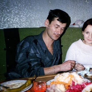Two people sharing a festive meal indoors.