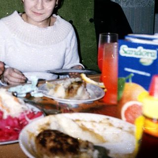 Two people sharing a festive meal indoors.
