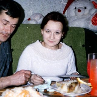 Two people sharing a festive meal indoors.