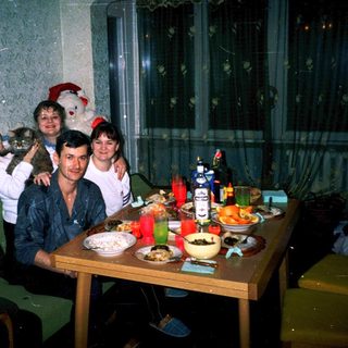 Family gathering indoors during holiday celebration.
