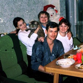 Family gathering indoors during holiday celebration.