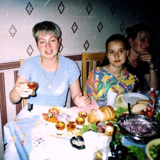 Family celebrating with festive table food.