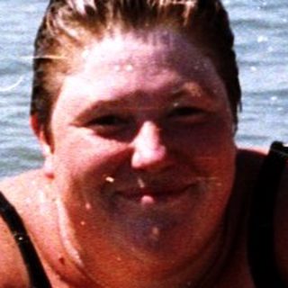 Person enjoying inflatable float in ocean water.