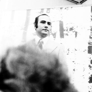 Portrait of a man in formal attire.