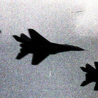 Five jets in tight aerial formation.