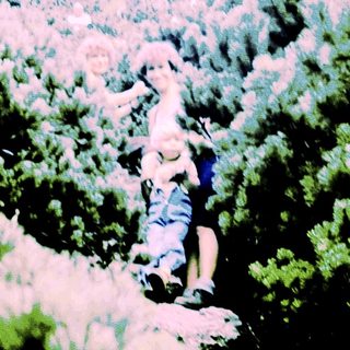 Person climbing rocky mountain slope.